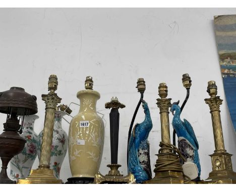 Two pairs and another Chinese porcelain table lamp, a pair of brass Corinthian column table lamps, two others and an oil lamp
