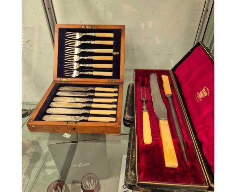 Cased silver handled tea knives, carving set, and fish eaters 