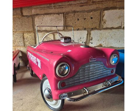 A rare 1960's Tri-Ang pedal car with Pegasus logo.