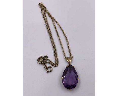 A vintage 9ct hallmarked gold gemset pendant and chain. 