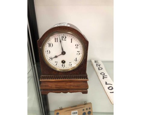 A Hamburg American Clock Co. mantel timepices in an oak case