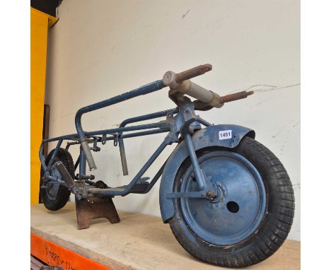A Brockhouse- Corgi Motorcycle folding scooter frame only and an associated fuel tank.