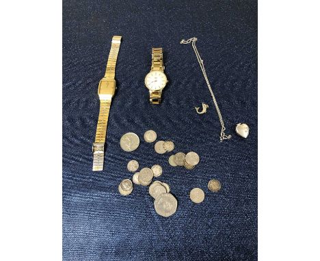 A Seiko wrist watch and one other, a silver locket, chain and dolphin charm, and various coins. 