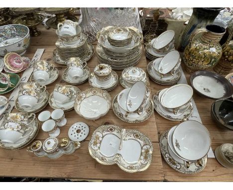 A Noritake gilt decorated dinner set