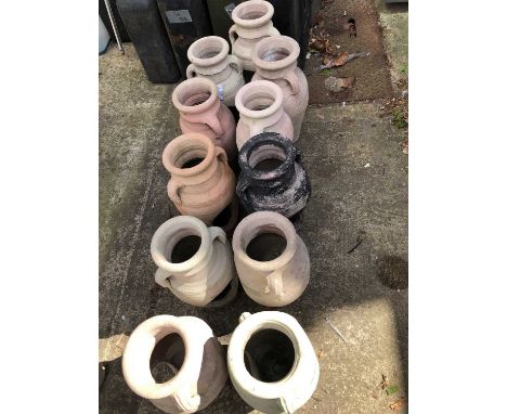 Eleven terracotta urn-form jars.