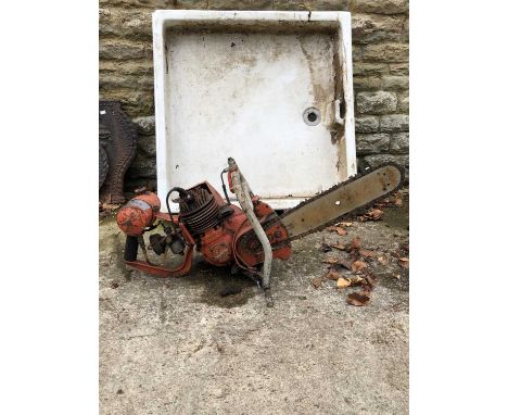 A large heavy petrol chainsaw.
