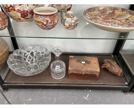 A glass punch bowl, a decanter, a leather mounted box and a carved wooden bird