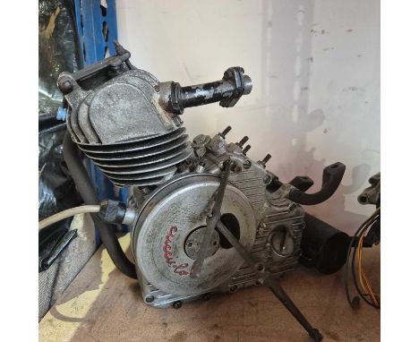 A 1950's Ducatti Cucciolo 4 stoke single cyclinder engine and a japanese motorcycle engine.