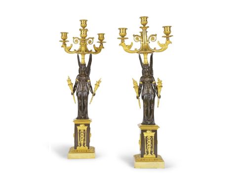 Paire de candélabres à trois branches de lumière en bronze patiné et doré d'époque EmpireA pair of Empire patinated bronze an