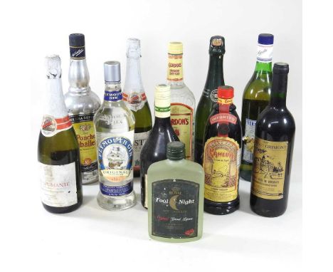 A collection of bottles of spirits, to include gin