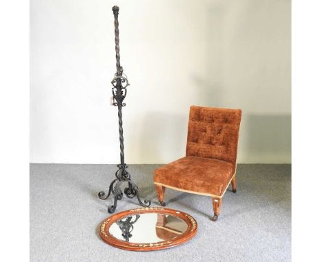 A gilt framed wall mirror, together with a nursing chair and a wrought iron standard lamp (3)