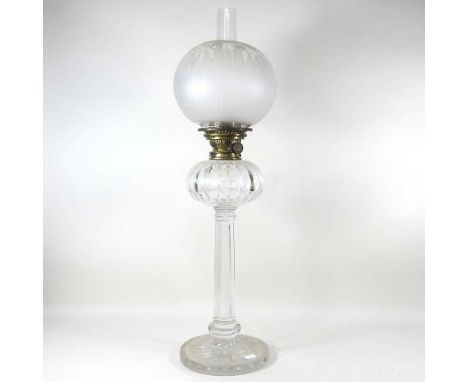 A 19th century cut crystal oil lamp, with a facet stem and star cut base, with shade, 74cm high overallDirty, but appears to 