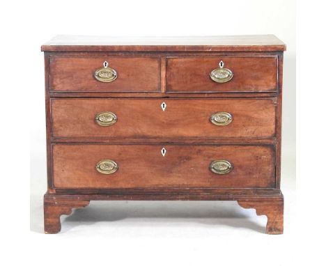 A George III mahogany and crossbanded chest of drawers, on bracket feet. Note: a non-transferable ivory exemption certificate