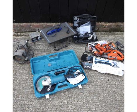 ARR A Makita disc cutter, together with a bench saw, electric saws and a bench grinder