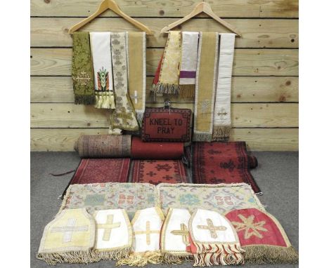 A collection of ecclesiastical textiles, to include kneeling prayer pads and vestments, together with two small Persian runne