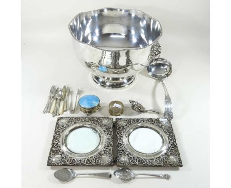 An Edwardian silver double photograph frame, Sheffield 1904, 35cm wide, together with a silver plated punch bowl, a silver tr