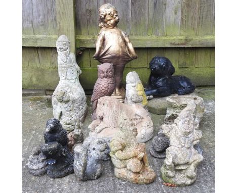 A cast stone garden model of a labrador, 40cm wide, together with a collection of small garden figures