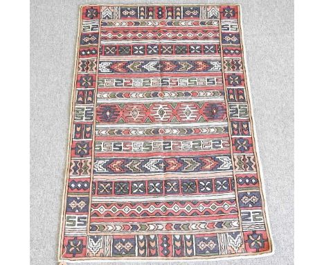 A hand stitch wool chain, with rows of geometric designs, 148 x 90cm