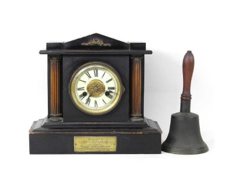 A Victorian ebonised mantel clock, together with a table bell, 28cm high (2)Has a pendulum, but no key. Looks complete but in