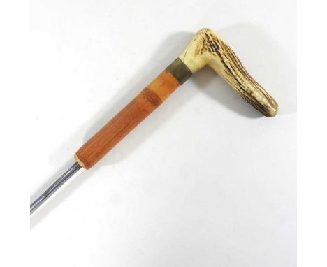 A 19th century bamboo swordstick, with an antler handle and brass tip, the blade stamped ANNO 1830 and the collar with intial