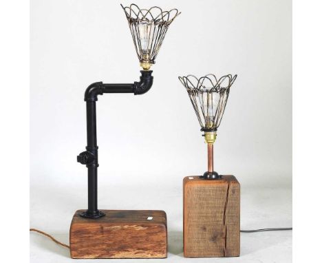 A vintage style lamp, on a rustic wooden base, 65cm high overall, together with another (2)