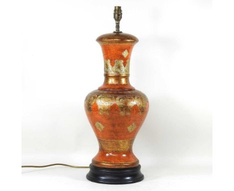 A table lamp, decorated with scrolls, 62cm highOverall condition is complete and usable. Light signs of use, but no visble da