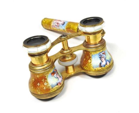 A pair of early 20th century gilt and enamel opera glasses, with mother of pearl decoration, 11cm wideLenses are usable and a