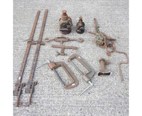 A pair of sash cramps, various clamps and tools