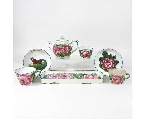A Wemyss pottery teapot and cover, painted with cabbage roses, signed Wemyss T Goode &amp; Co to base, 11cm high, together wi