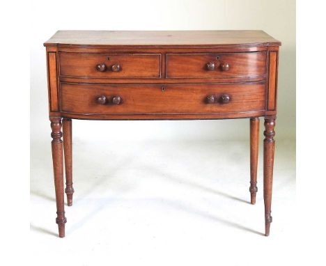 An unusual Regency mahogany side table, with a projecting front, containing three drawers, on ring turned legs92w x 50d x 82h