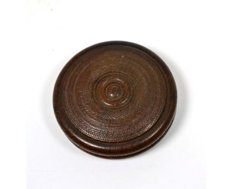 A carved snuff box, circular form, made from timbers after 1829 York Minster fire, labelled
