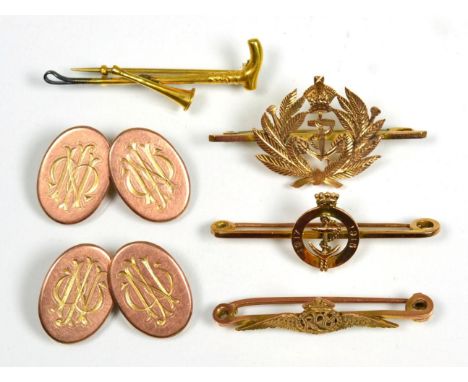 A pair of 9 carat rose gold double oval cufflinks, chain linked, monogrammed; two Royal Navy sweetheart brooches, stamped '9C