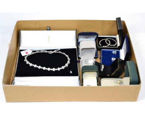An octagonal cut solitaire cubic zirconia ring, finger size N, stamped '14k'; a pair of matching earrings, with post fittings