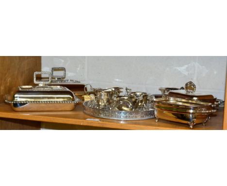 A silver sauce boat; a George III silver caddy spoon; and a silver toast rack; together with a group of plated items includin