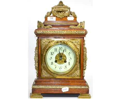 An oak and brass mounted striking mantel clock circa 1890