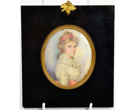 English School (early 19th century): miniature bust portrait of a young girl, wearing a red scarf and white dress with red sa