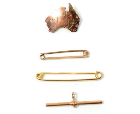 A ruby set Australian states brooch, measures 2.5cm by 2.5cm, stamped '9CT'; a tie bar, stamped '15CT', another stamped '9CT'
