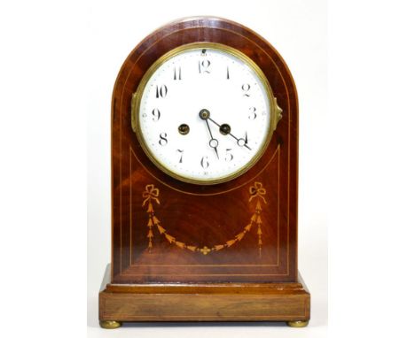 An Edwardian inlaid mahogany striking mantel clock