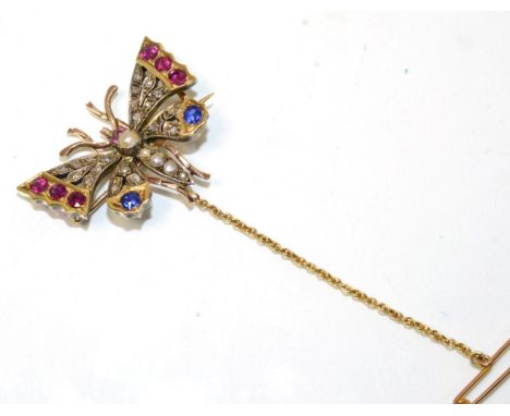 A multi-gemstone butterfly brooch, with a pearl set body, ruby set eyes and wings set with rose cut diamonds, round cut rubie
