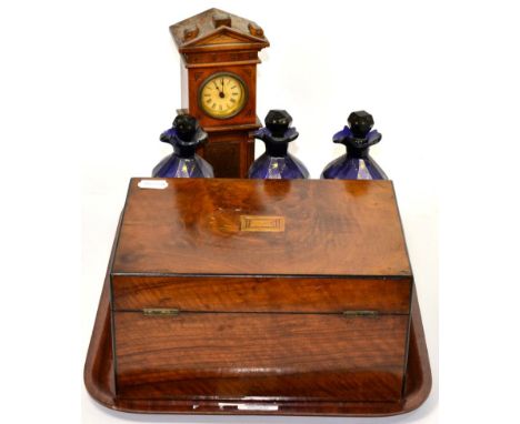 A 19th century walnut box; a miniature longcase clock and three Bristol blue decanters