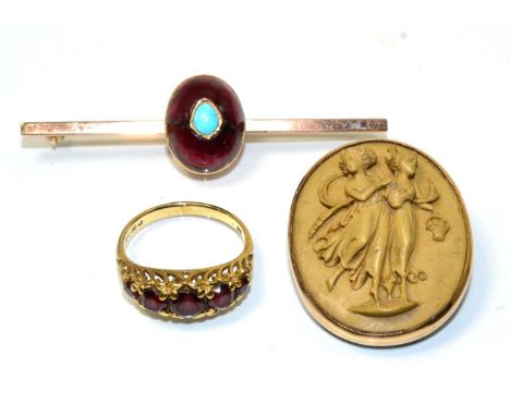 A garnet and turquoise bar brooch, an oval cabochon garnet inset with a pear cabochon turquoise, to a flat sided bar, length 