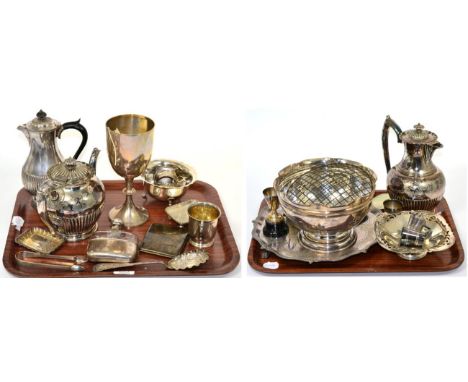 A silver trophy cup; silver sugar tongs; four silver napkin rings; a silver mug; a silver vesta; a silver card case; a silver