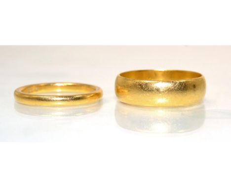 A broad 22 carat gold band ring, finger size R and a narrow 22 carat gold band ring, finger size N (2)10.5g gross