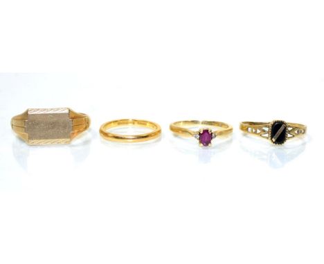 A ruby and diamond three stone ring, an oval cut ruby spaced by round brilliant cut diamonds, to tapered shoulders, finger si