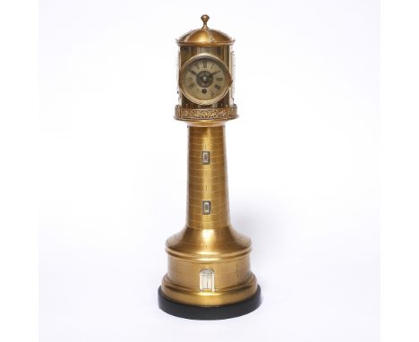 A brass automaton lighthouse clock circa 1900 the revolving top with clock, barometer and two thermometers on a tapering colu