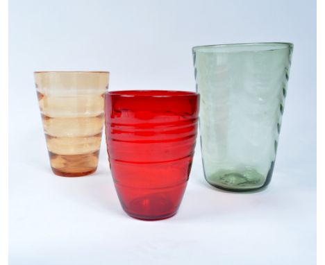 Whitefriars three glass vases, circa 1950 a '9030' vase in ruby, a '8473' vase in clear green, and one other tallest 26cm hig