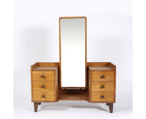 Gordon Russell Cotswold School oak dressing table, circa 1940 mirror flanked by drawers with turned handles, all raised on ta