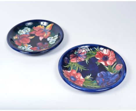 Walter Moorcroft (1917-2002) 'Anemone' pattern plate and one similar plate initialled in underglaze green 22cm diamater and 2