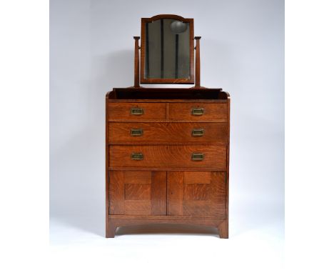 Heals Oak dressing chest, circa 1905 swing mirror over drawers and cupboard section, with stylised brass handles 167cm high, 