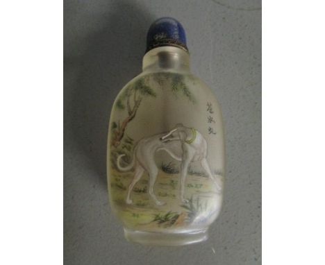A late 20th century Chinese glass reverse painted snuff bottle with Lapis Lazuli stopper and gilt metal band, decorated with 